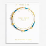 Bracelet with 'You Got This' message on a white background, featuring gold and blue beads. Available at Be Charmed