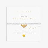 A Littles & Co Kids' Bee-You-Tiful Silver Bracelet featuring a silver-plated bumblebee charm on a stretch bead band, displayed on a playful message card reminding children to be themselves, a sweet and encouraging gift available at Be Charmed