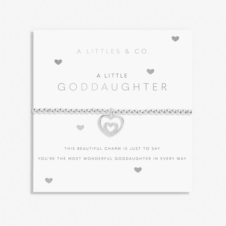 A Littles & Co Kids' Silver Goddaughter Bracelet featuring a sweet silver-plated heart charm on a stretch bead band, displayed on a sentimental goddaughter message card, a beautiful keepsake gift for special occasions, available at Be Charmed