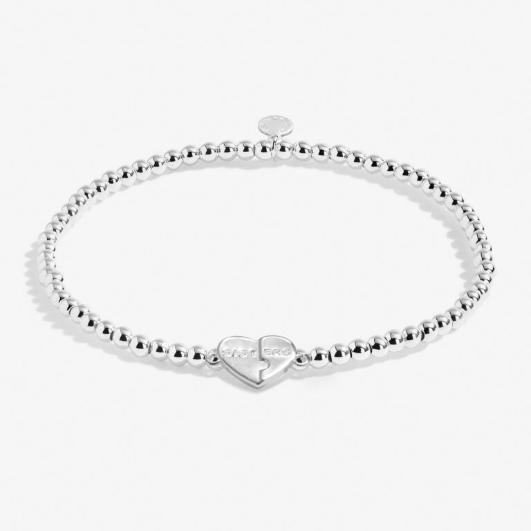 A Littles & Co Kids' Sisters Together Forever Silver Bracelet—delicate silver design symbolizing sisterly love, perfect keepsake from Be Charmed.
