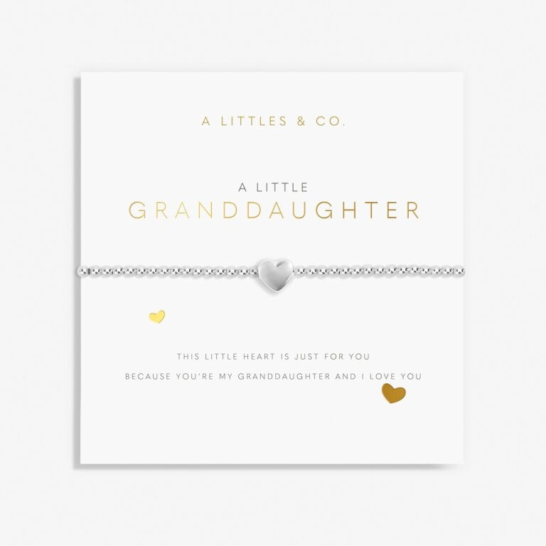 A Littles & Co Granddaughter Silver Bracelet featuring a dainty silver-plated heart charm on a stretch bead band, displayed on a loving sentiment card, a treasured gift for granddaughters, available at Be Charmed