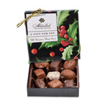 Box of chocolates with a decorative lid featuring holly design and Abdallah Chocolates branding. Available at Be Charmed. 