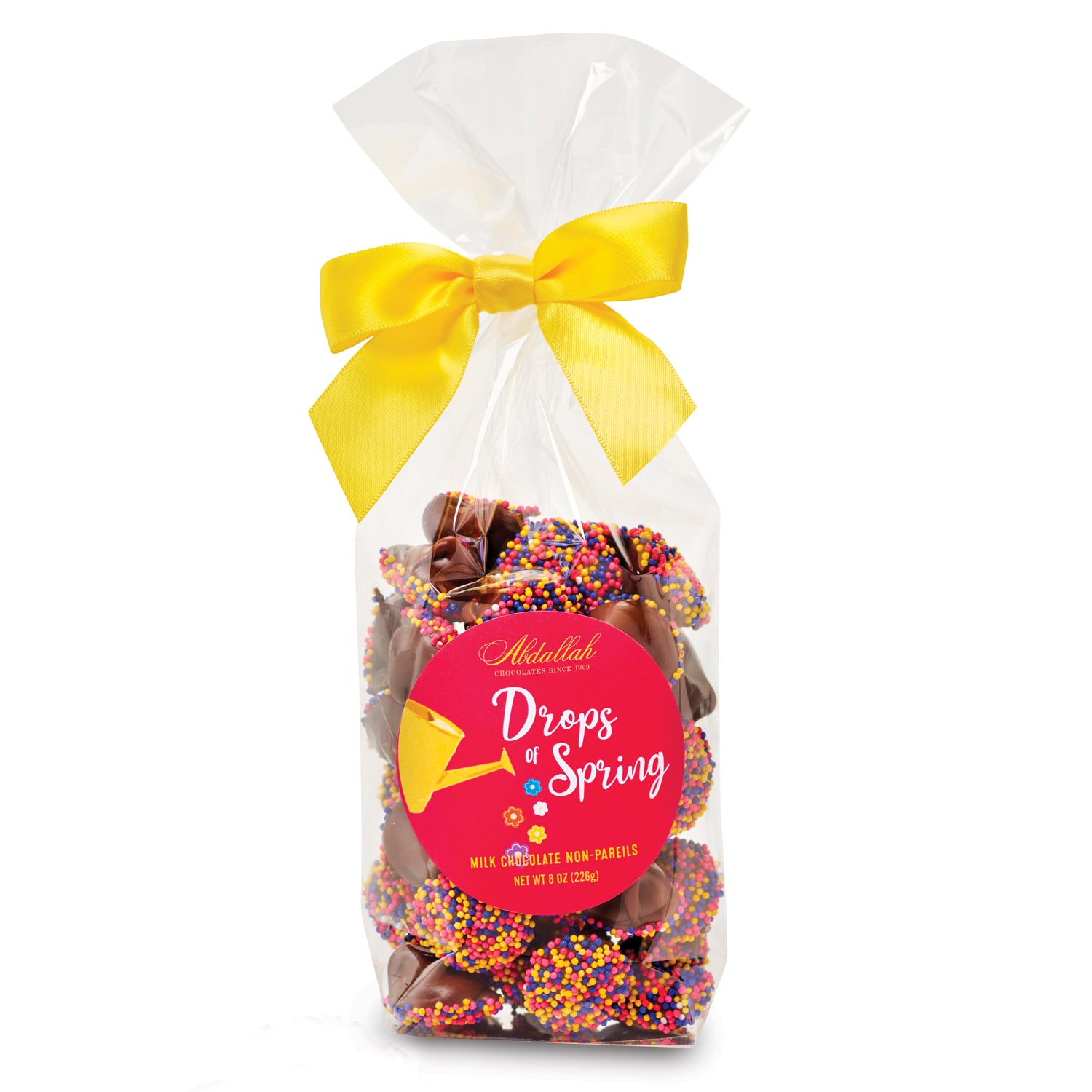 Packaged Abdallah non-parelis chocolate treats with colorful sprinkles and a yellow bow on a white background. Available at Be Charmed