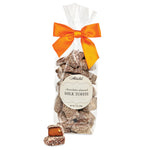 Bag of Abdallah chocolate almond milk toffee with an orange bow on a white background. Available at Be Charmed. 