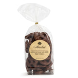 Clear bag of Abdallah milk chocolate pretzels with a gold label on a white background. Available at Be Charmed