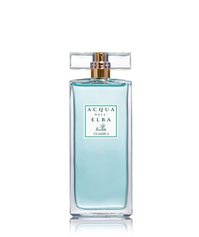 A clear glass bottle of Acqua Dell'Elba Eau De Parfum with a blue liquid and a gold and clear cap. Available at Be Charmed