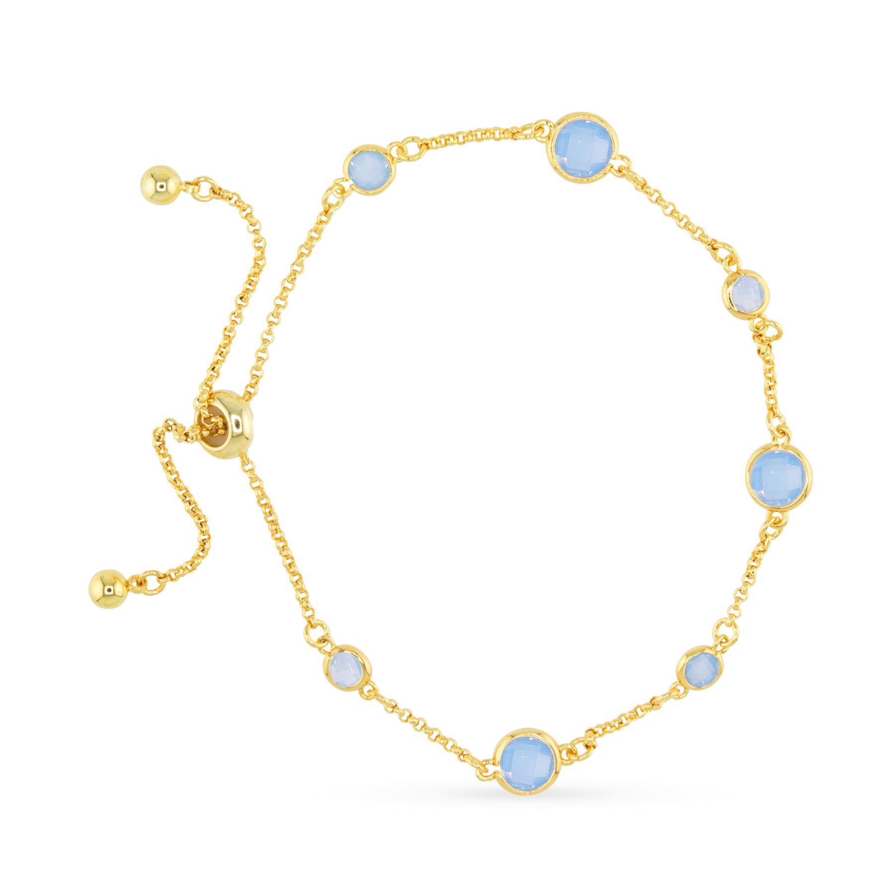 Gold bracelet with light blue gemstones on a white background. Available at Be Charmed