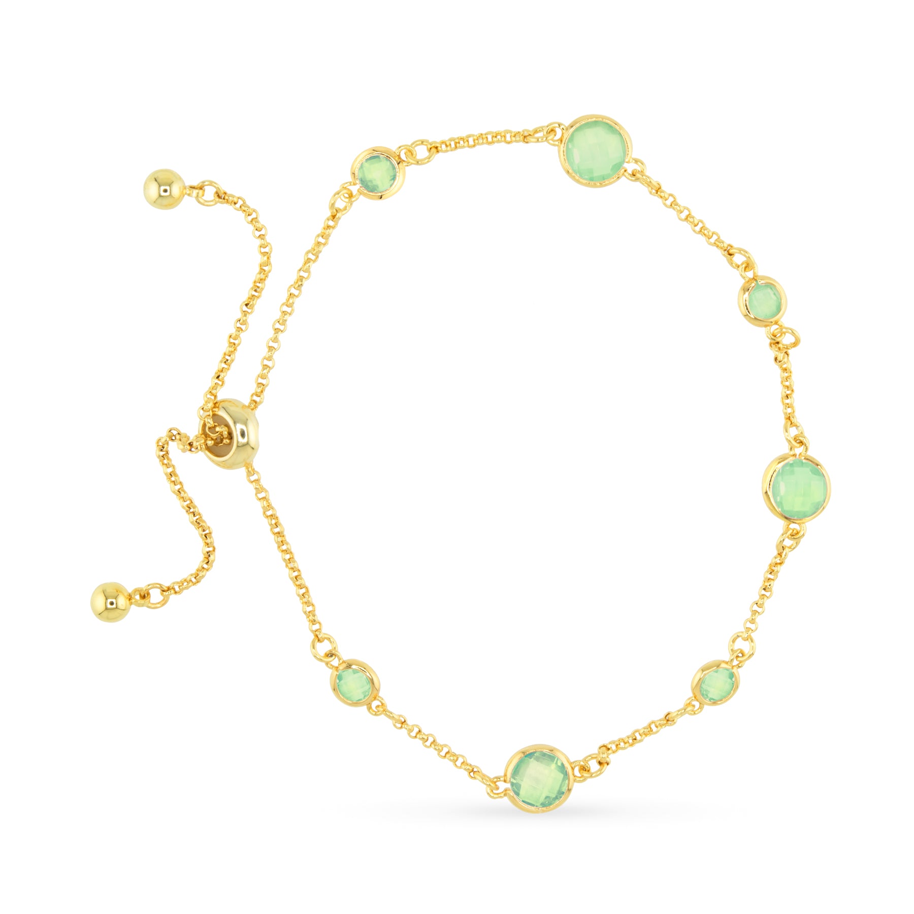 Gold bracelet with green gemstones on a white background. Available at Be Charmed