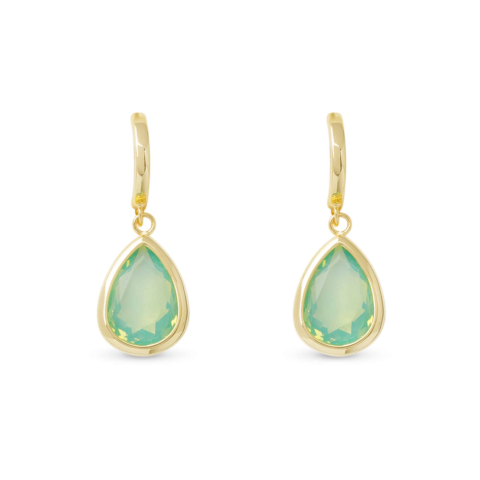 Gold earrings with green teardrop-shaped gemstones on a white background. Available at Be Charmed