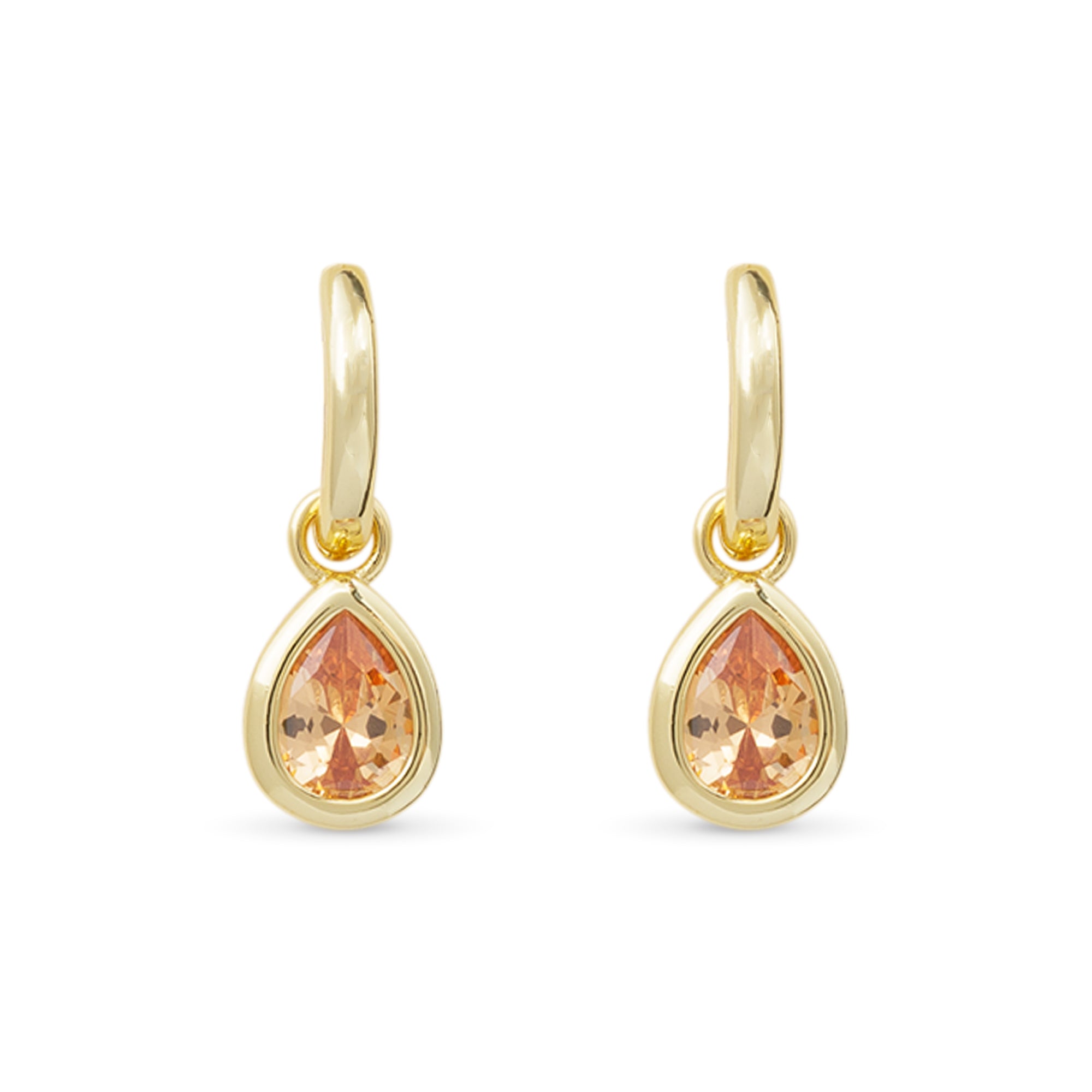 Gold earrings with teardrop-shaped topaz gemstones on a white background. Available at Be Charmed