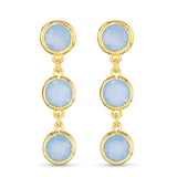 Gold earrings with blue gemstones on a white background. Available at Be Charmed