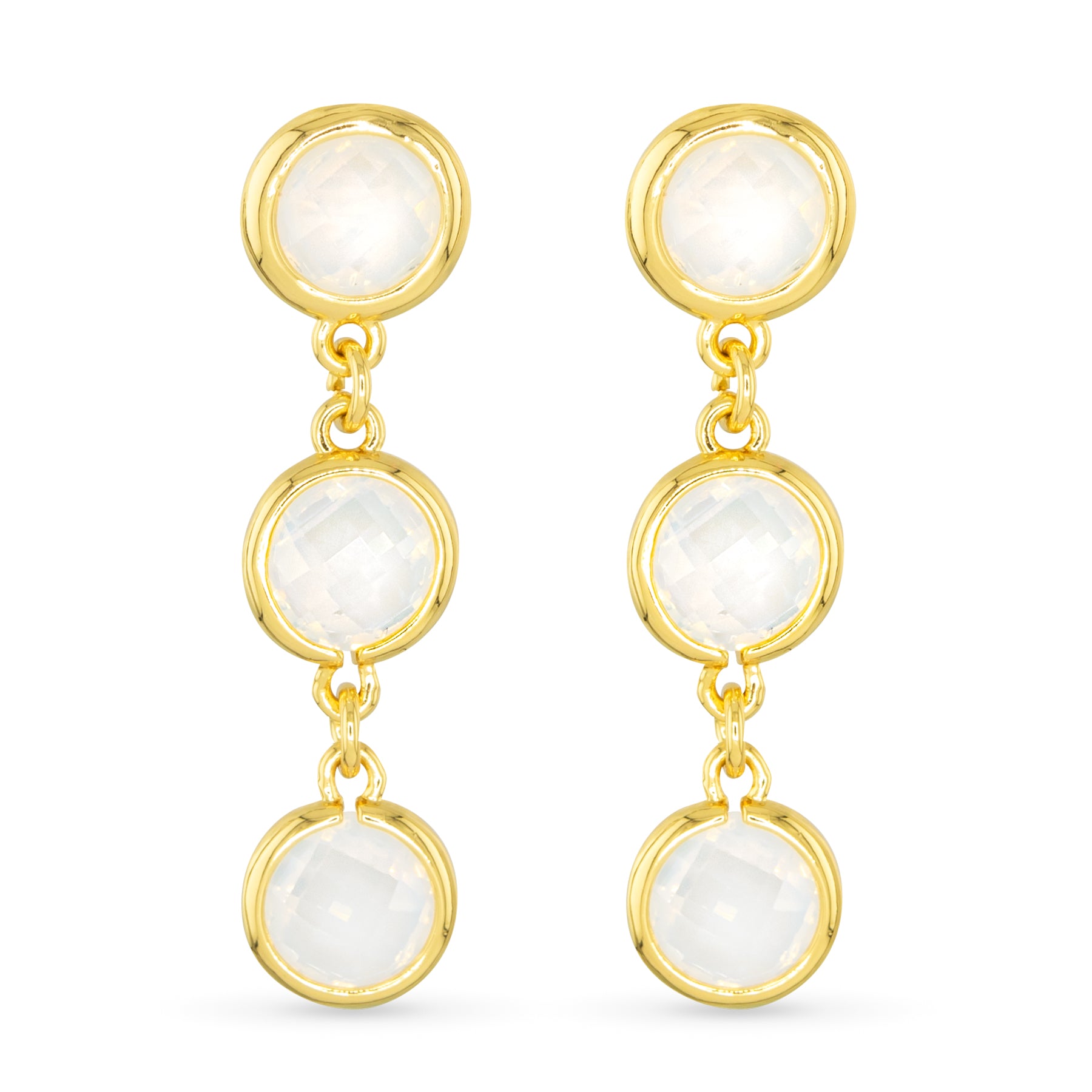 Gold earrings with white gemstones on a white background. Available at Be Charmed