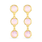 Gold earrings with pink gemstones on a white background. Available at Be Charmed