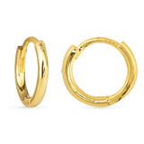 Gold hoop earrings on a white background. Available at Be Charmed