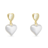 Heart-shaped silver earrings with gold hooks on a white background. Available at Be Charmed