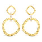 Gold hoop earrings with diamond-like stones on a white background. Available at Be Charmed