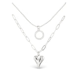 Silver Amanda Blu CZ Dual Layer Circle & Heart Necklace –  18″ chain with extender, featuring sparkling cubic zirconia circle and heart pendants. Available at Be Charmed.