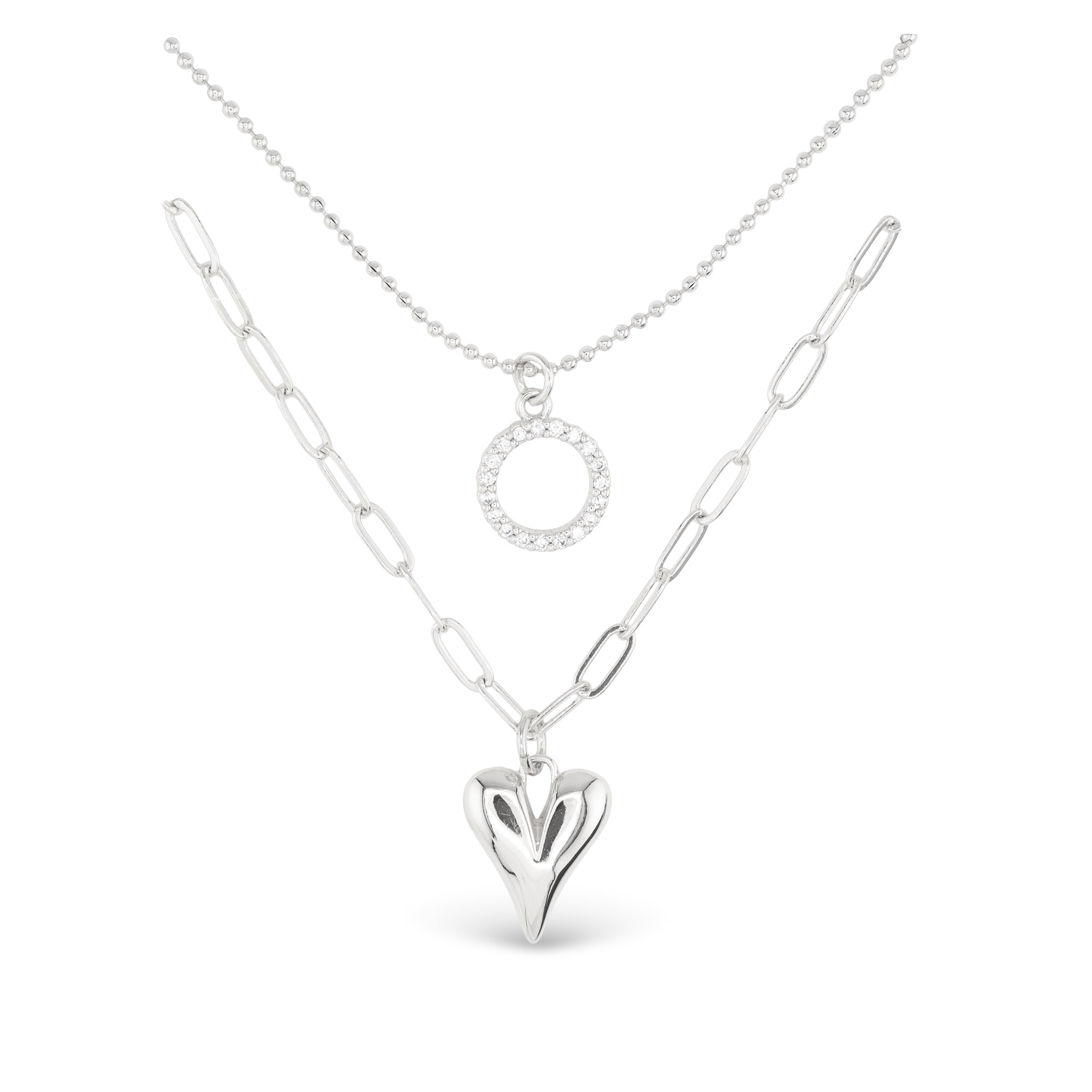 Silver Amanda Blu CZ Dual Layer Circle & Heart Necklace –  18″ chain with extender, featuring sparkling cubic zirconia circle and heart pendants. Available at Be Charmed.
