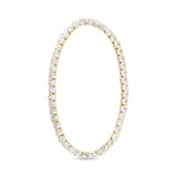 Gold tennis bracelet with clear gemstones on a white background. Available at Be Charmed