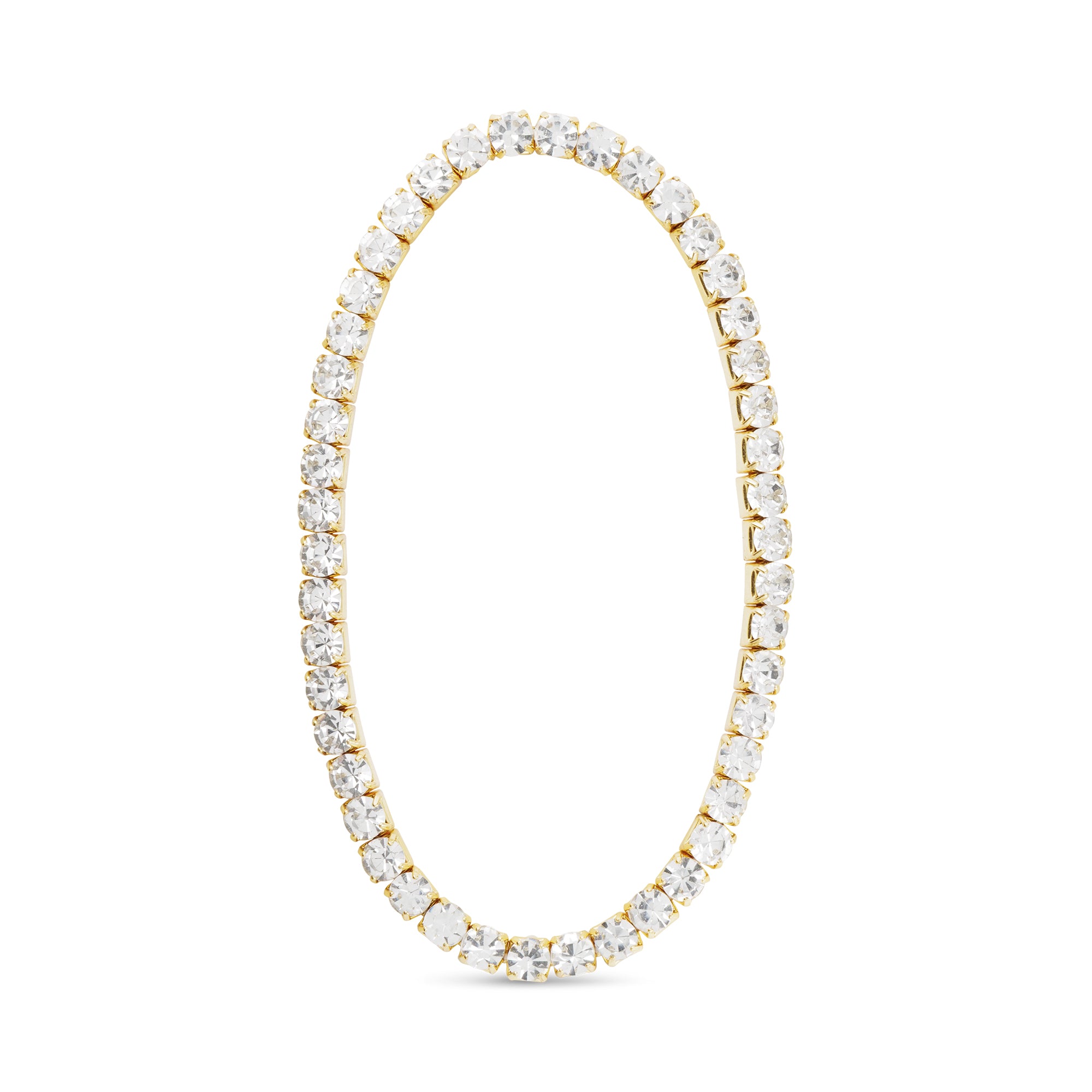 Gold tennis bracelet with clear gemstones on a white background. Available at Be Charmed