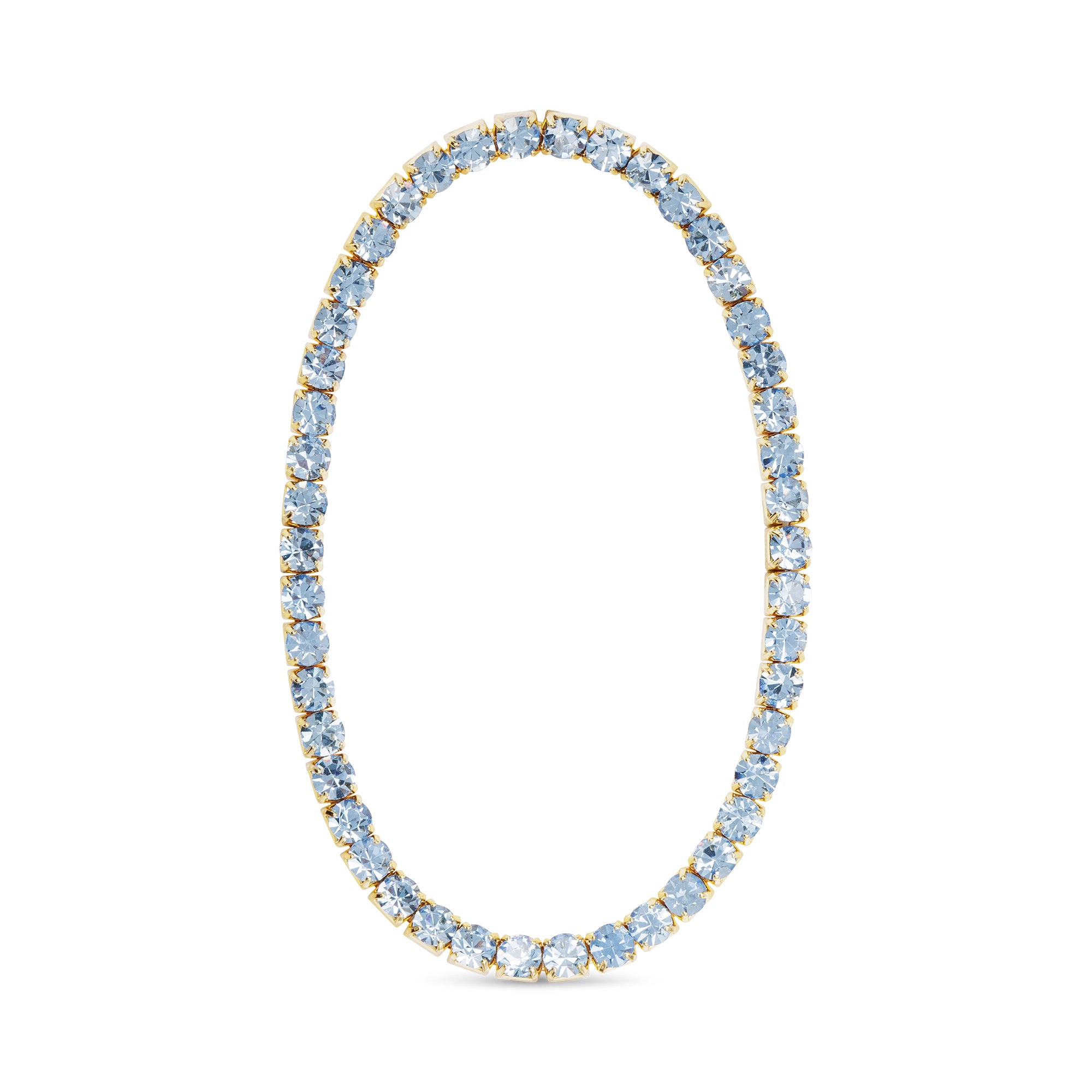 Tennis Bracelet with light blue gemstones and gold accents on a white background. Available at Be Charmed