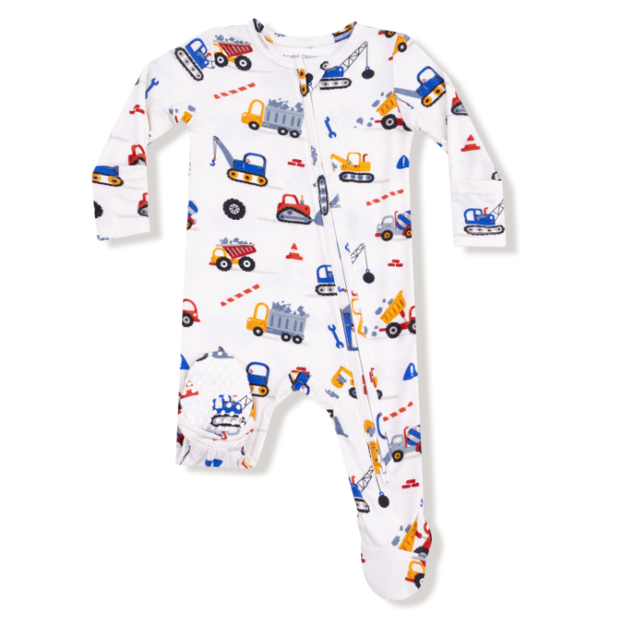 Baby onesie with construction vehicle pattern on a white background. Available at Be Charmed. 