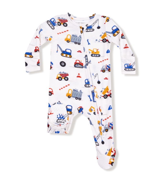 Baby onesie with construction vehicle pattern on a white background. Available at Be Charmed. 