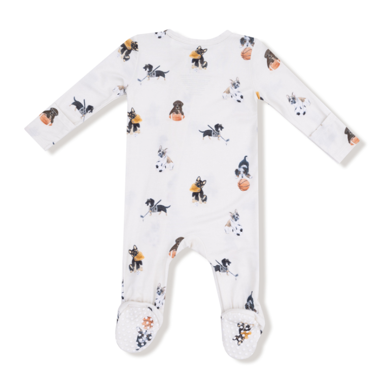 Baby onesie with sport themed dogs including football, hockey and basketball on a white background. Available at Be Charmed. 