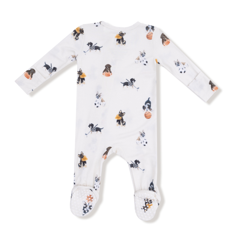Baby onesie with sport themed dogs including football, hockey and basketball on a white background. Available at Be Charmed. 