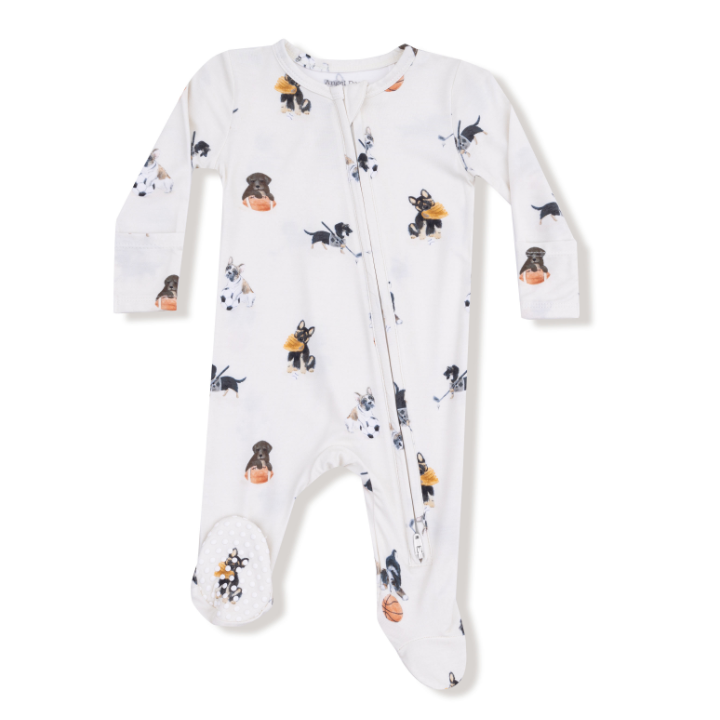 Baby onesie with sport themed dogs including football, hockey and basketball on a white background. Available at Be Charmed. 