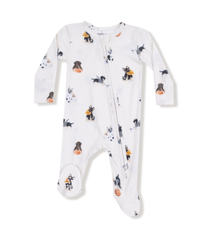 Baby onesie with sport themed dogs including football, hockey and basketball on a white background. Available at Be Charmed. 