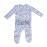 Baby romper with floral pattern and ruffle detail on a white background. Available at Be Charmed. 