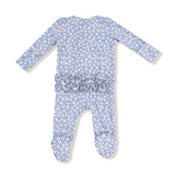 Baby romper with floral pattern and ruffle detail on a white background. Available at Be Charmed. 