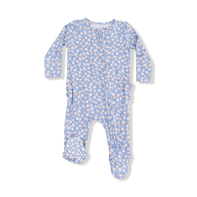 Baby onesie with floral pattern on a white background. Available at Be Charmed. 