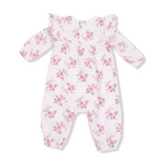 Floral-patterned baby onesie on a white background. Available at Be Charmed. 