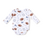 Baby onesie with football pattern on a white background. Available at Be Charmed. 