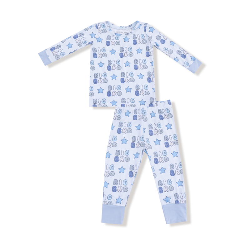 Children's pajama set with 'big bro' text and star patterns on a white background. Available at Be Charmed. 