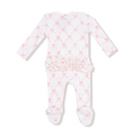Baby onesie with pink star pattern on a white background. Available at Be Charmed.