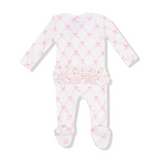 Baby onesie with pink star pattern on a white background. Available at Be Charmed.