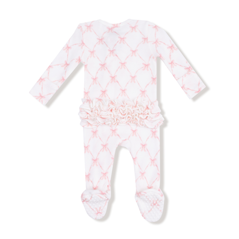Baby onesie with pink star pattern on a white background. Available at Be Charmed.
