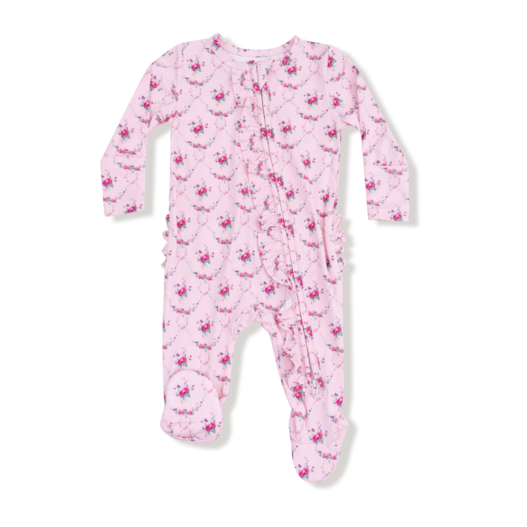 Pink baby onesie with floral pattern on a white background. Available at Be Charmed.