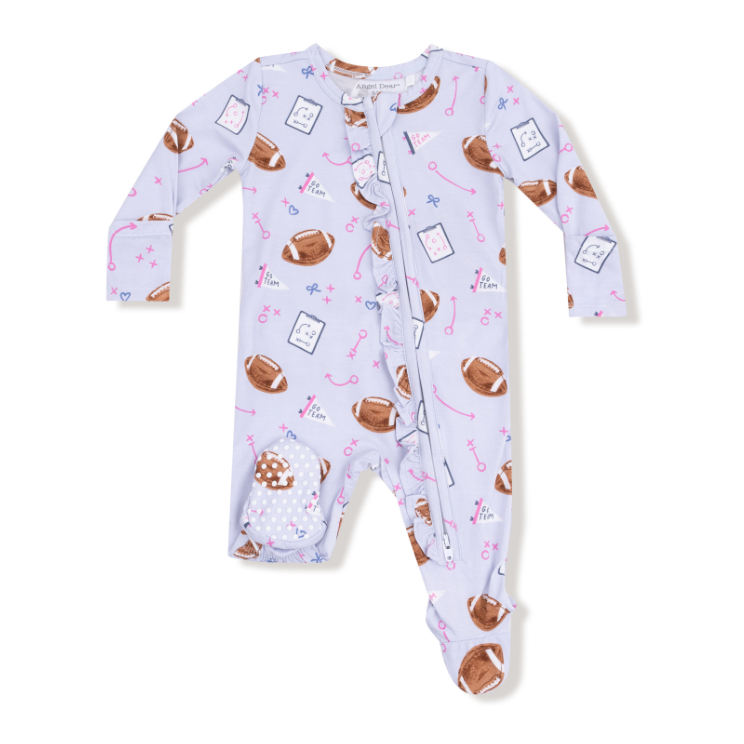 Baby girl onesie with lavander football pattern on a white background