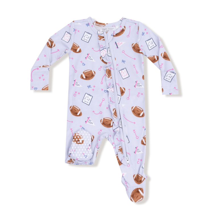 Baby girl onesie with lavander football pattern on a white background