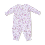 Floral-patterned baby romper on a white background. Available at Be Charmed. 