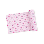 Pink fabric with floral pattern on a white background. Available at Be Charmed.