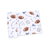 Unfolded baby blanket with football pattern on a white background. Available at Be Charmed. 