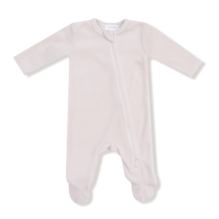 Angel Dear velour oatmilk colored baby onesie on a white background. Available at Be Charmed. 