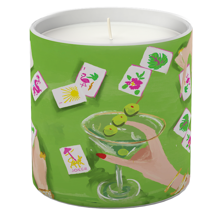 Candle in a green tin with a cocktail and card design on a white background. Available at Be Charmed
