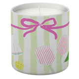 Candle in a decorative tin with a pink bow and striped design on a white background. Available at Be Charmed
