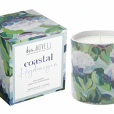 Annapolis Candle – Kim Hovell Coastal Hydrangea boxed candle with blue floral artwork and refreshing floral scent, inspired by coastal living. Ideal for gifting or home décor. Available at Be Charmed.

